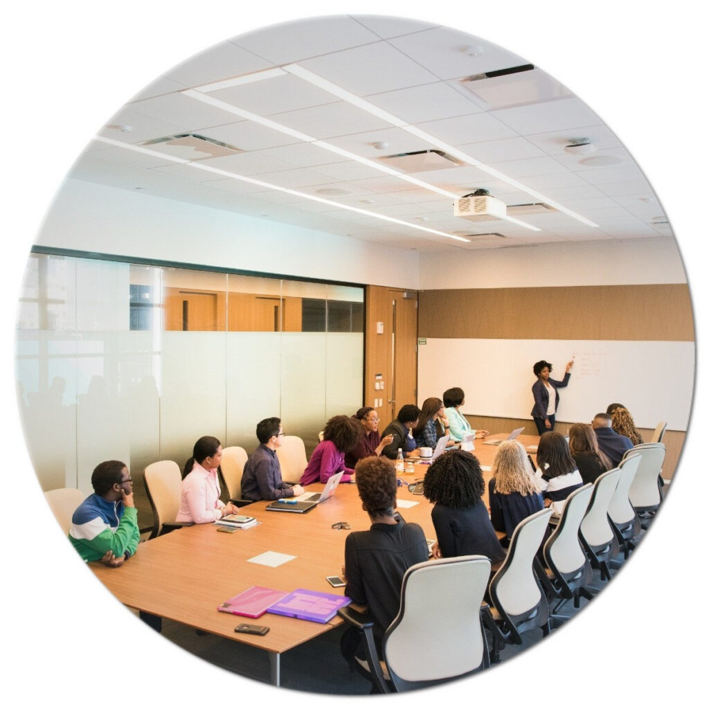 A group of people sitting around a conference table.